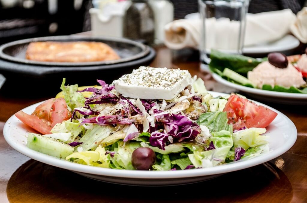 pexels photo 7282789 7282789 A delicious and colorful Greek salad with feta cheese, tomatoes, and olives, perfect for a healthy meal.