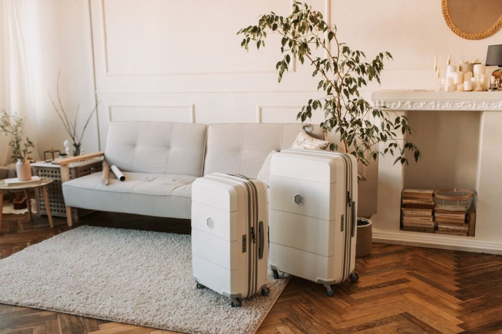 Chic living room interior featuring a stylish sofa and sleek white suitcases.